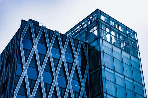 office building photo of building top under gray sky architecture